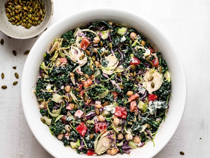 chopped kale salad with tahini dressing in bowl