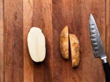 cutting potatoes in half