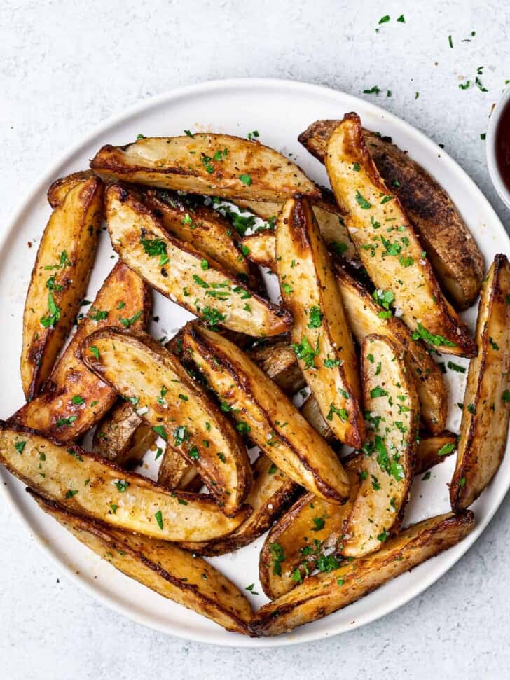 Baked Parmesan Potato Wedges served on plate 