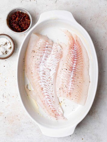 Raw fish in baking dish