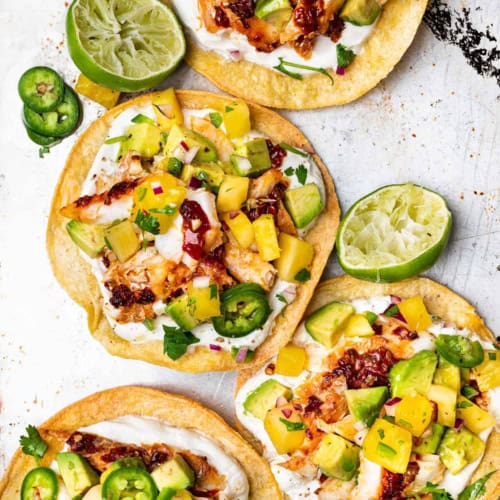 Tostadas topped with fish and pineapple salsa