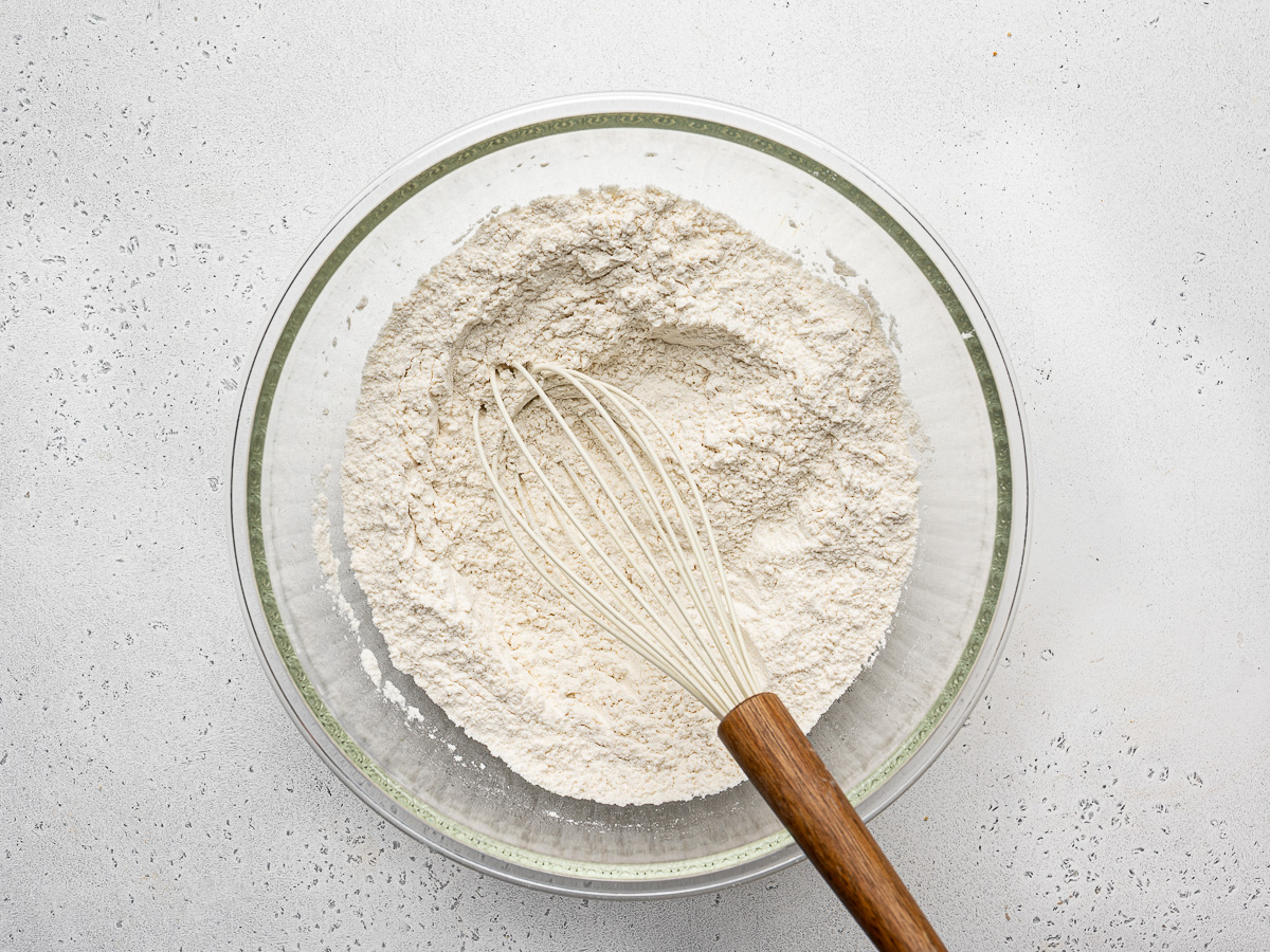 Dry ingredients mixed in glass bowl.