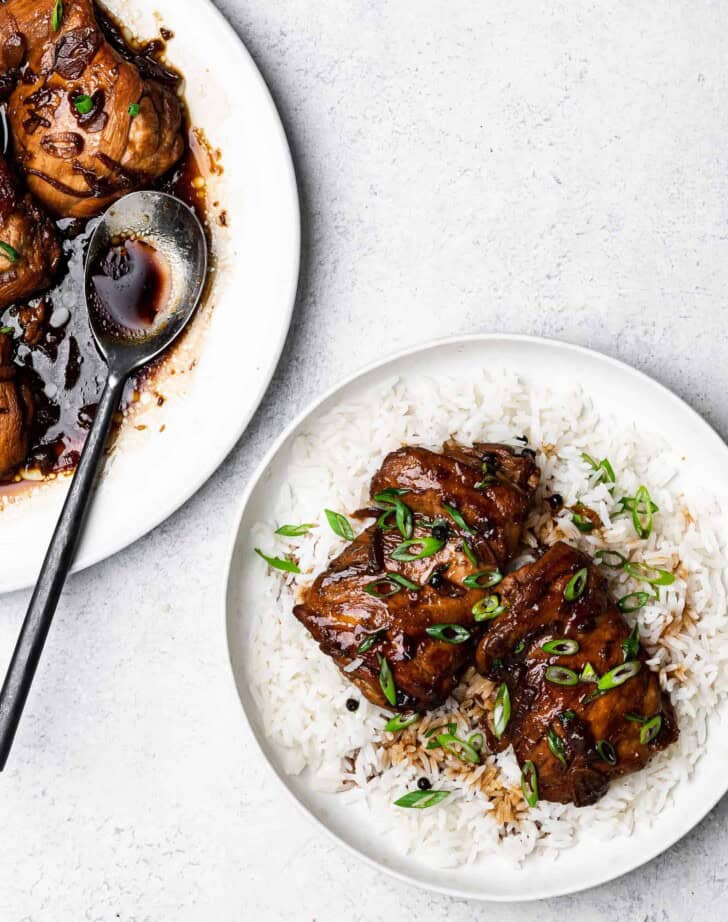 serving chicken adobo on plate with rice