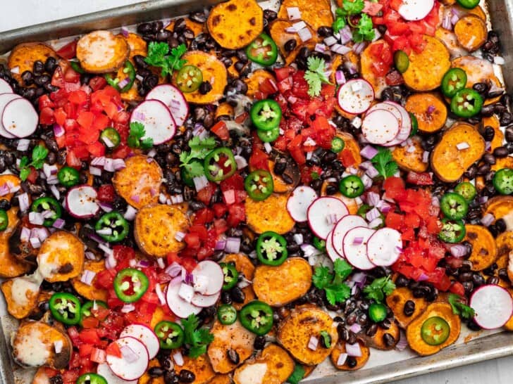 sweet potato nachos on sheet pan with toppings