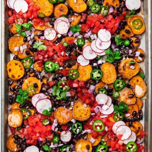 sweet potato nachos on sheet pan with toppings