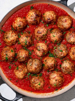 cooked Italian meatballs with tomato sauce in skillet