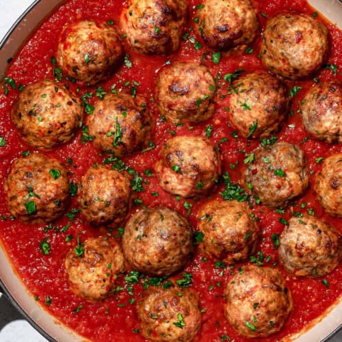 cooked Italian meatballs with tomato sauce in skillet