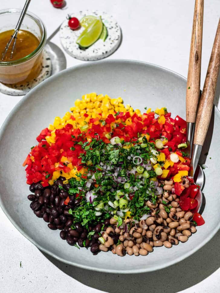 all ingredients in bowl ready to be mixed with vinaigrette