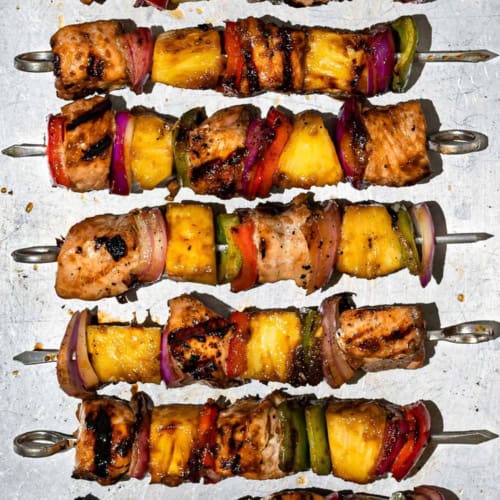 Grilled Pineapple salmon kabobs on baking sheet