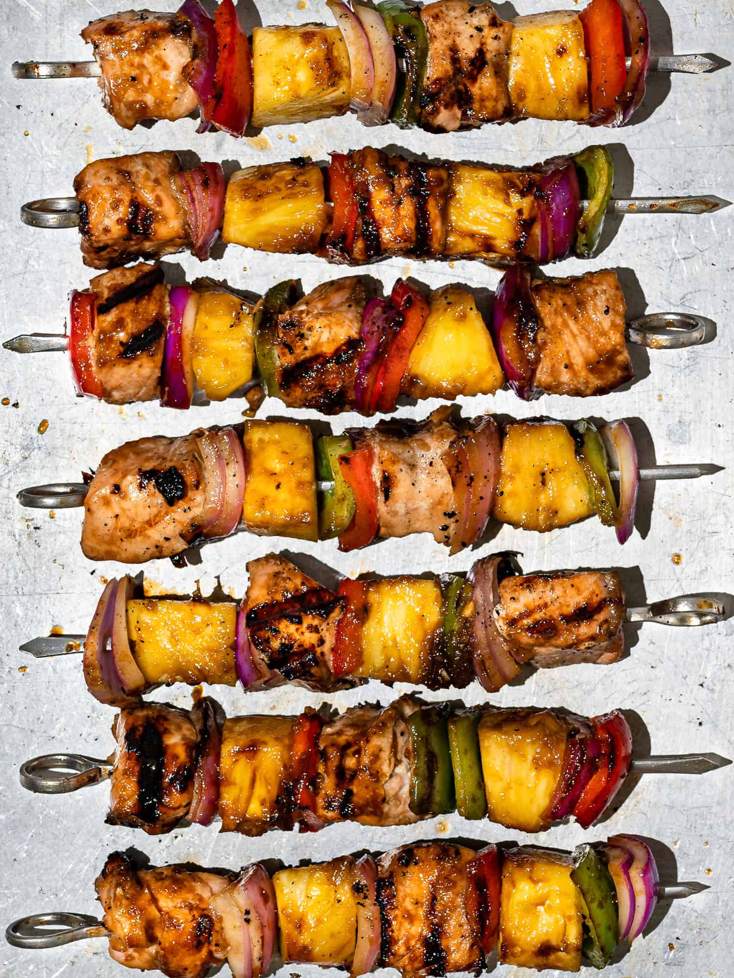 Grilled Pineapple salmon kabobs on baking sheet