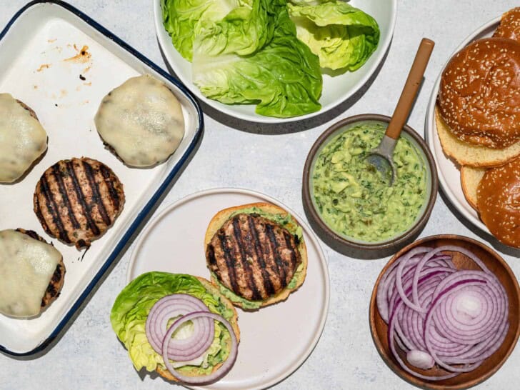 assembling burgers with toppings