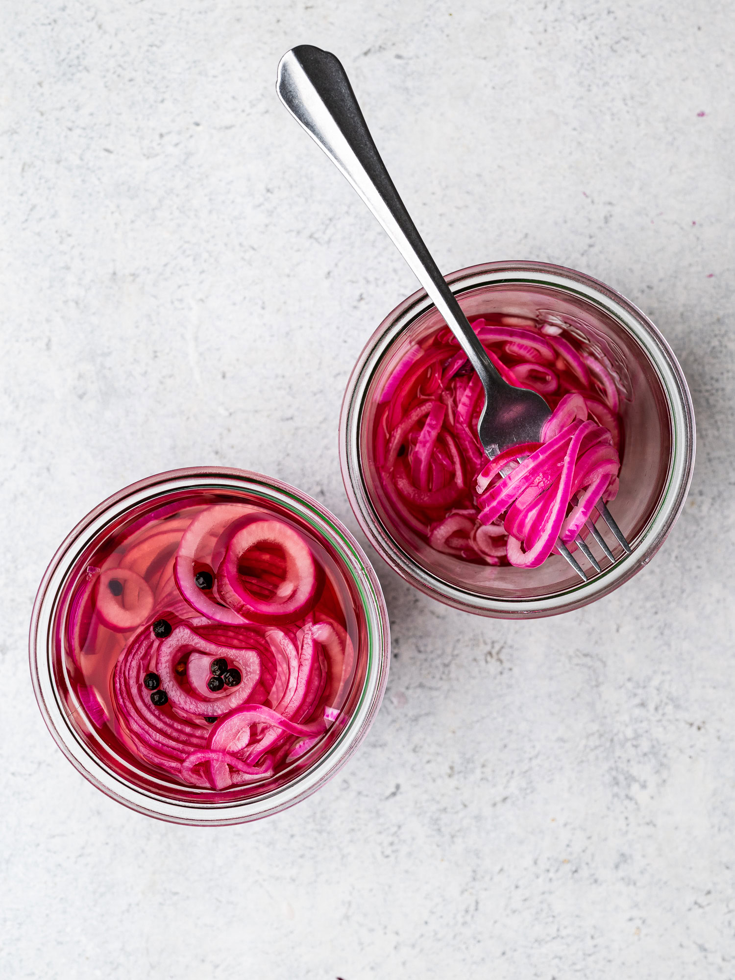 top-view of pickled red onions in jar