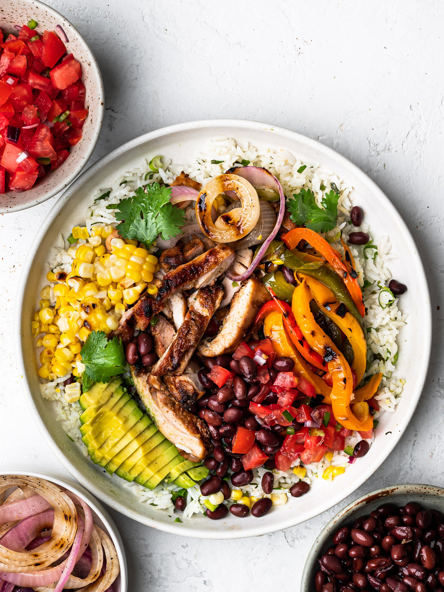 grilled chicken fajita bowl with cilantro lime rice with toppings on the side
