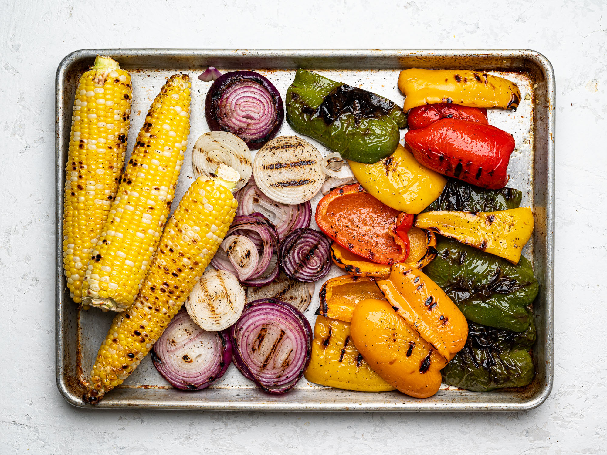 grilled vegetables on a sheet pan