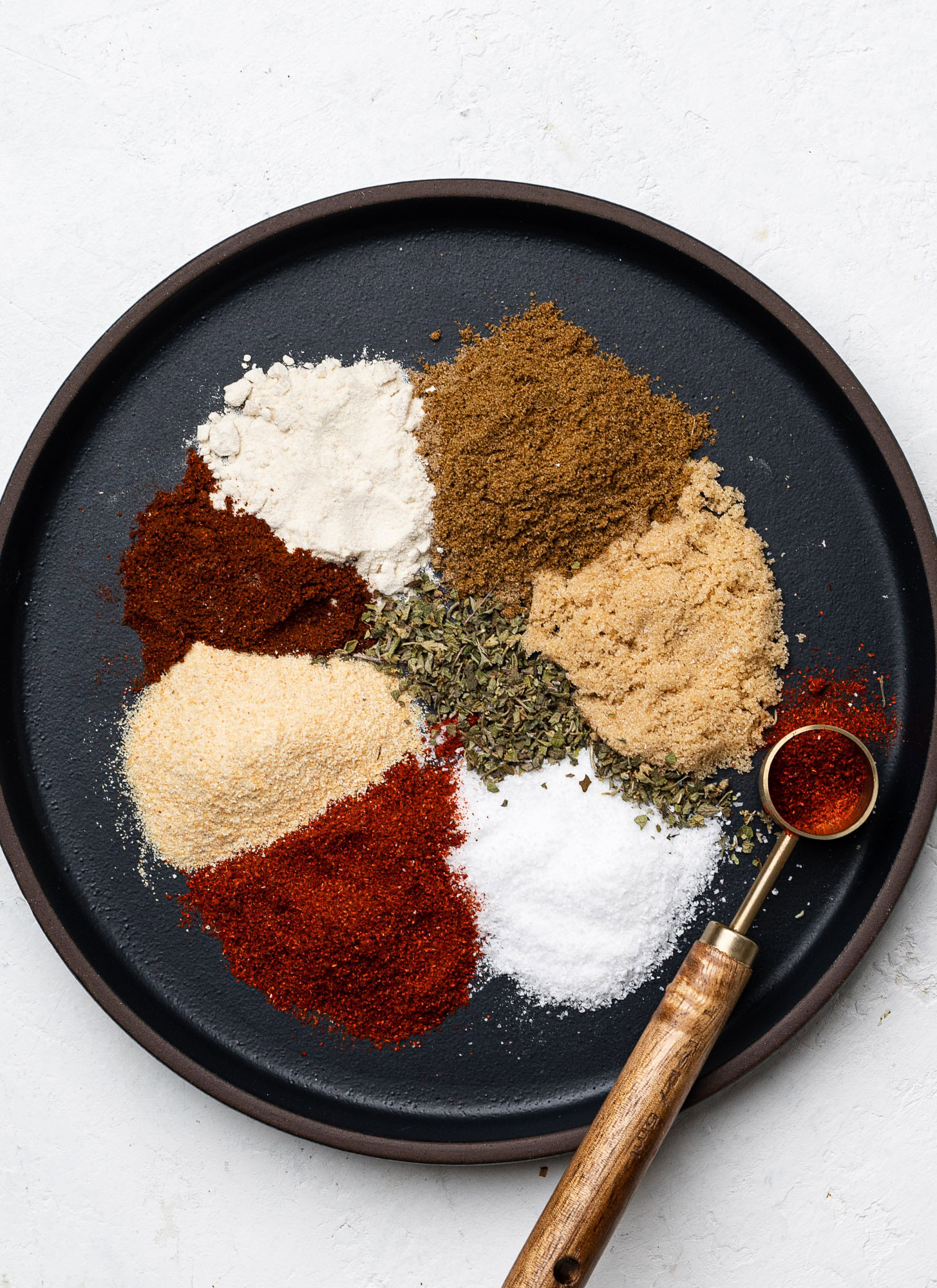 spices on a black plate