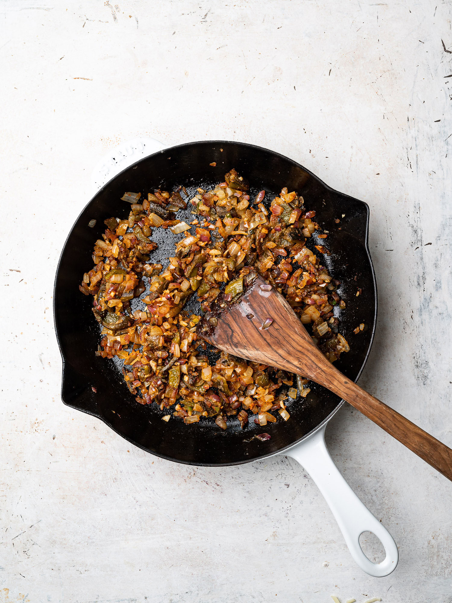 onions and spices sautéing in skillet