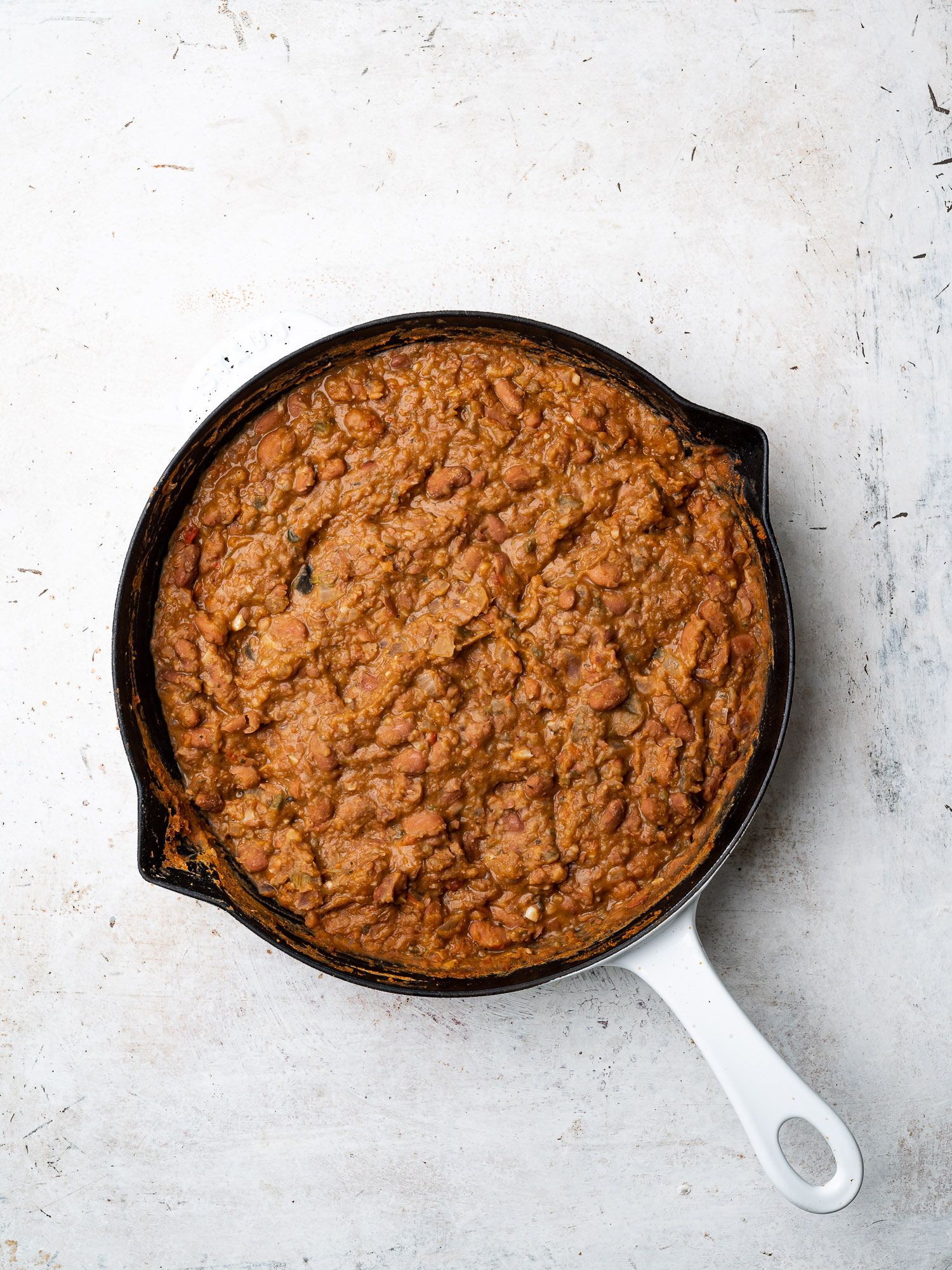 refried beans in skillet