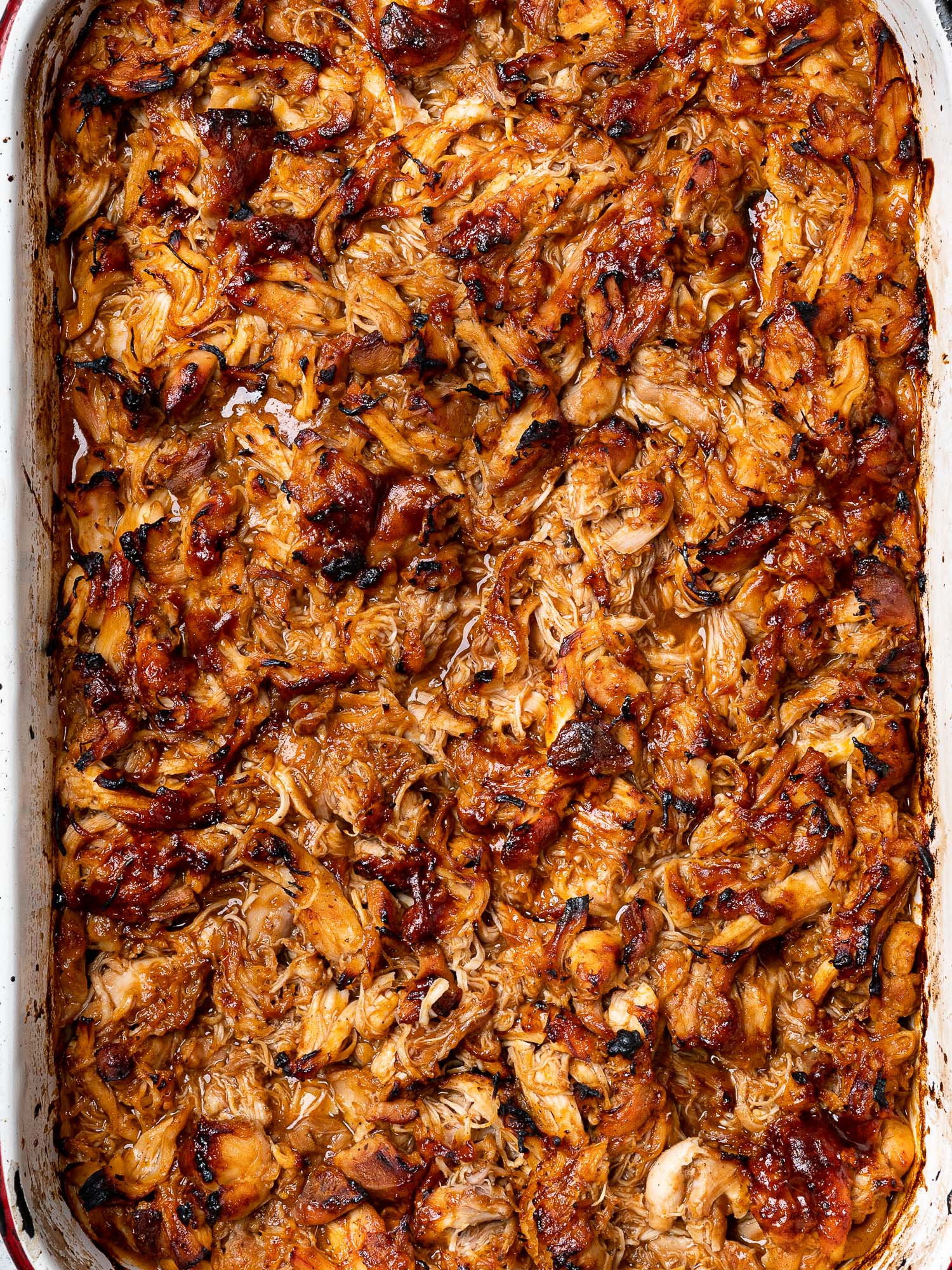 Close up of Pulled BBQ chicken in sheet pan