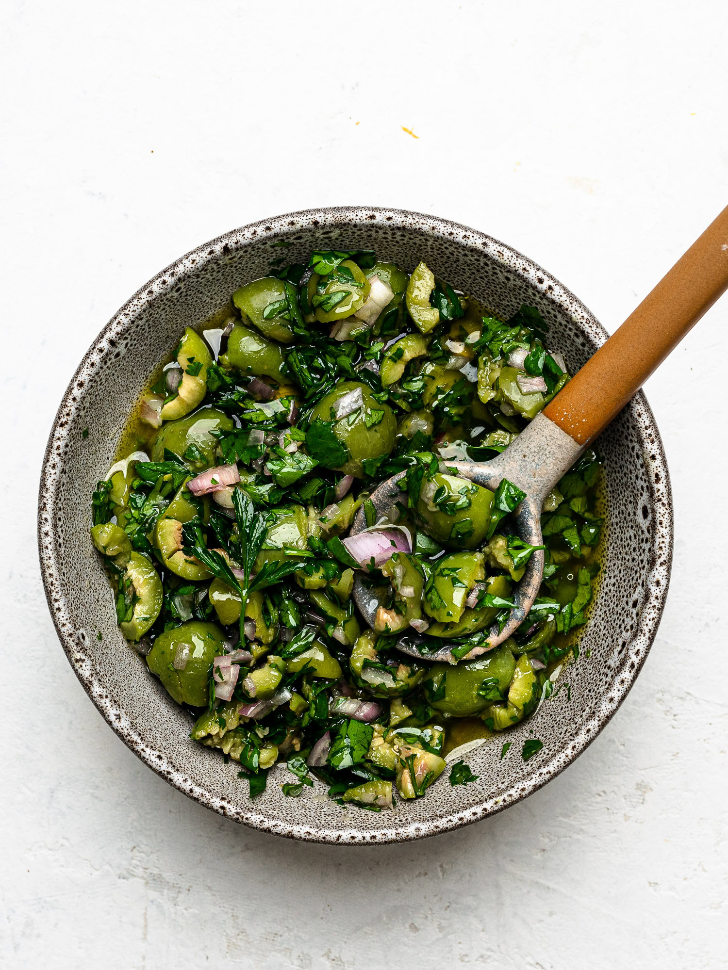 green olive salsa in small serving bowl