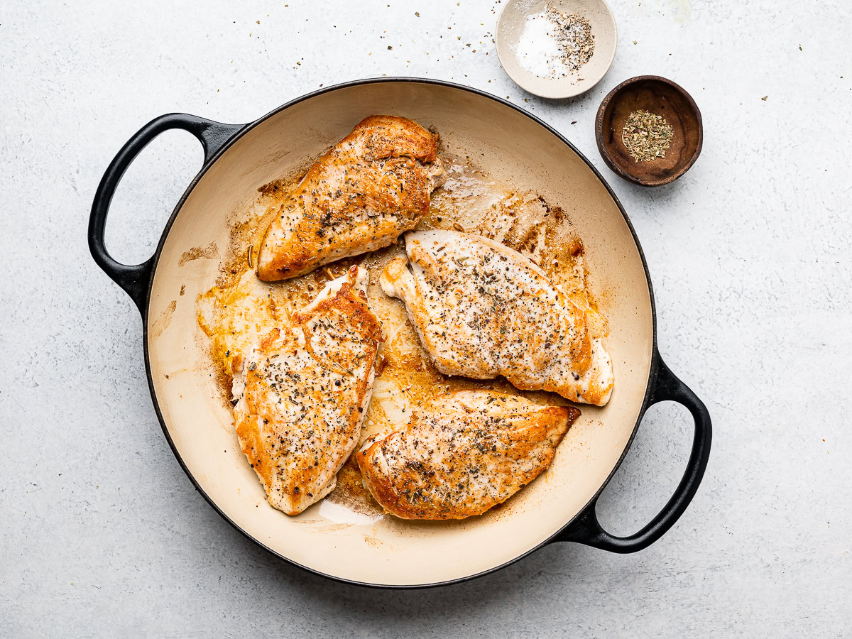 pan-seared chicken in skillet 