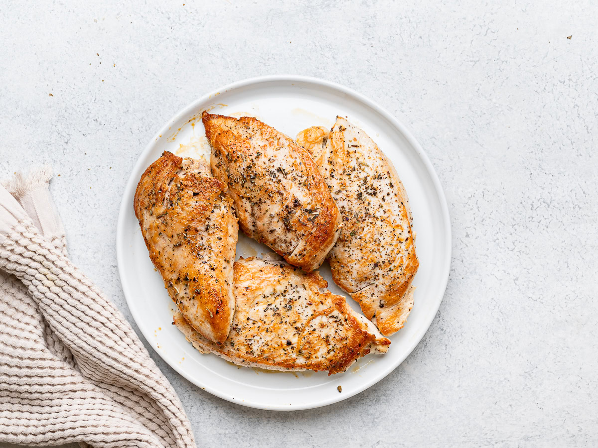 pan-seared chicken resting on plate