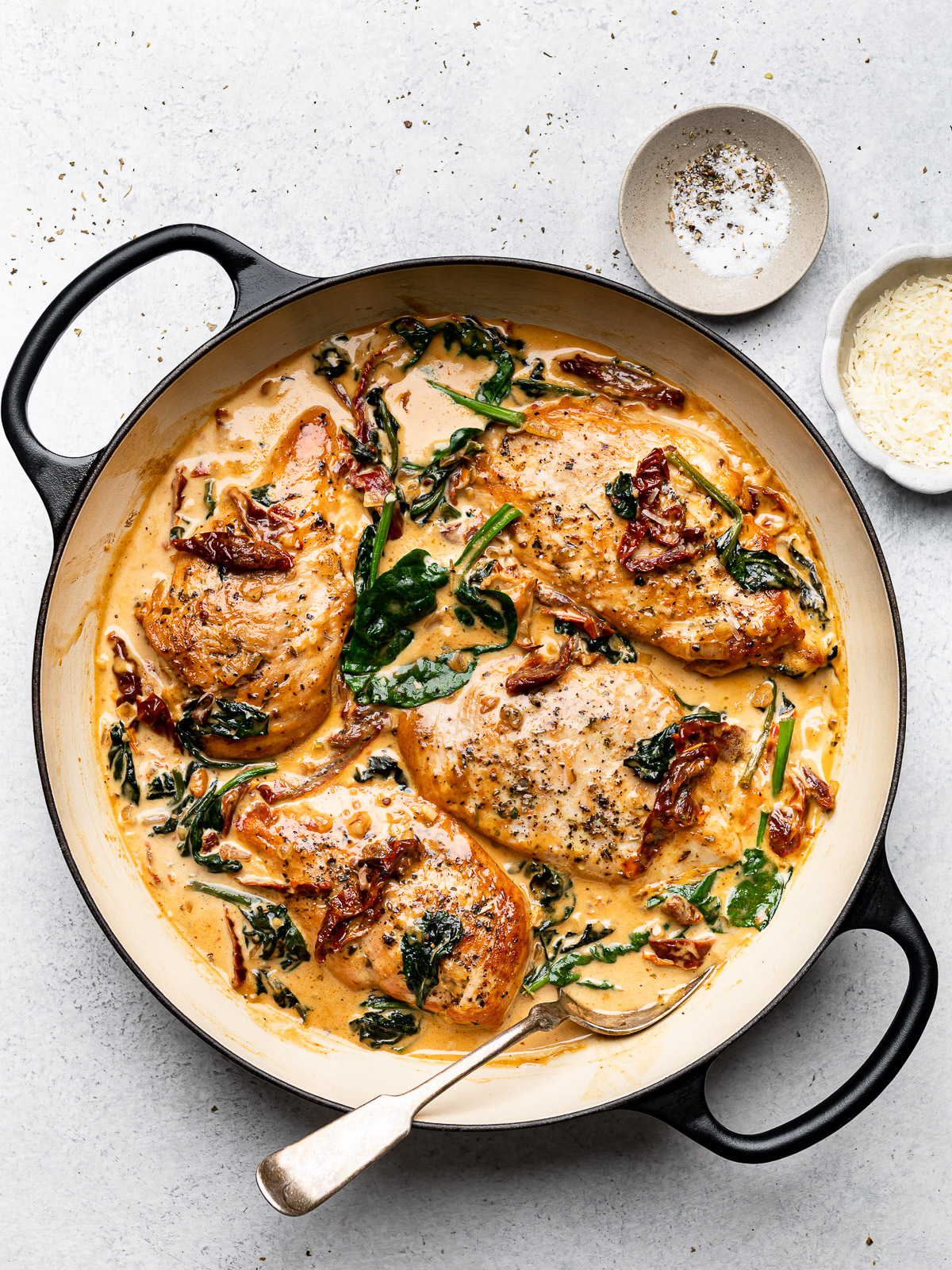 Cooked creamy Tuscan chicken in skillet