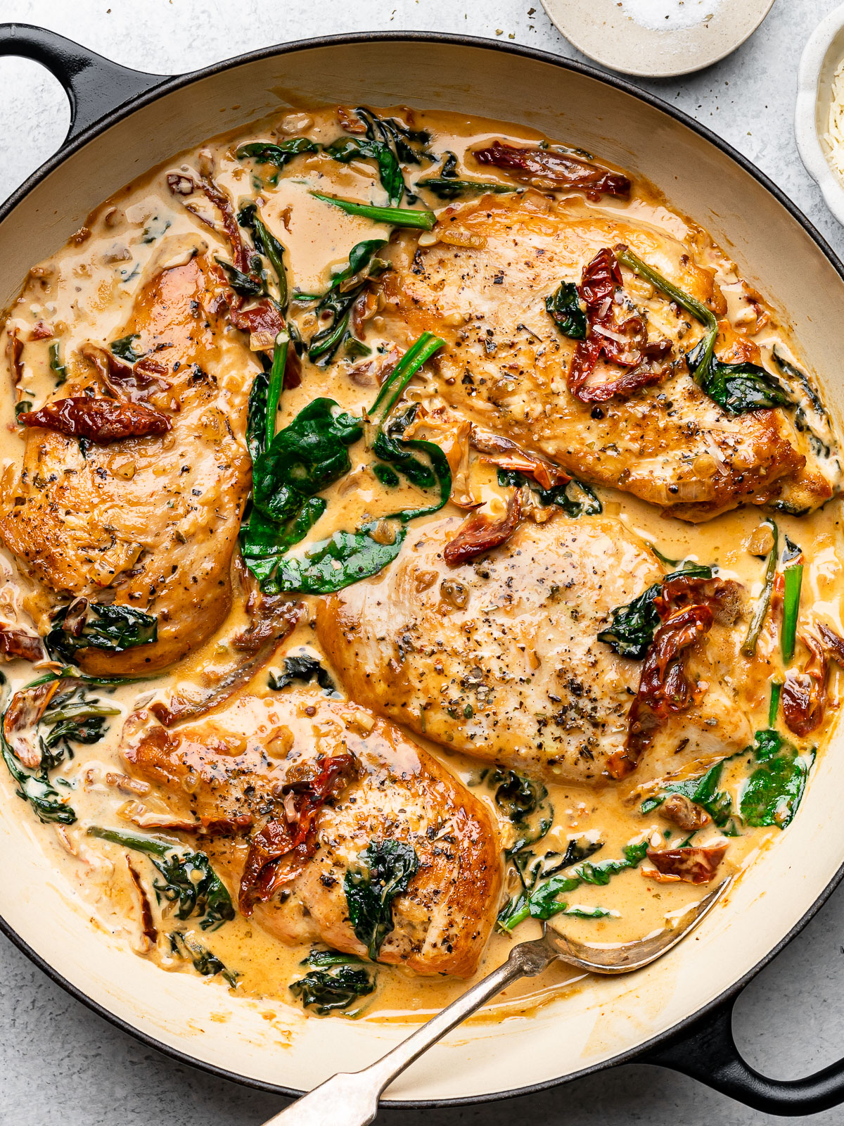 Cooked creamy Tuscan chicken in skillet