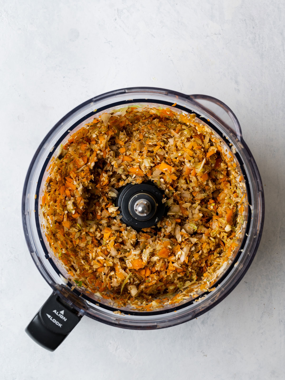 chopped vegetables in food processor bowl