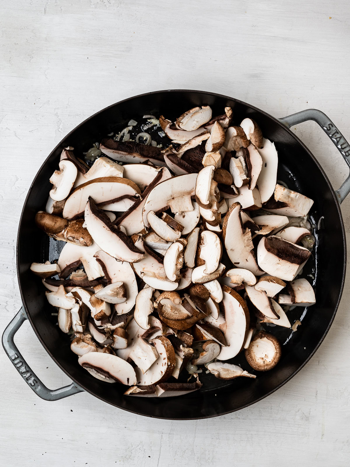 sliced mushrooms in skillet