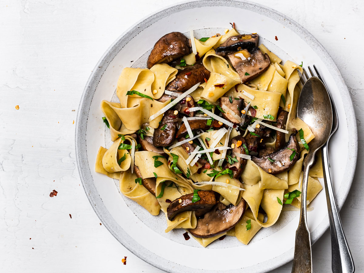 pappardelle with mushroom sauce served on plate