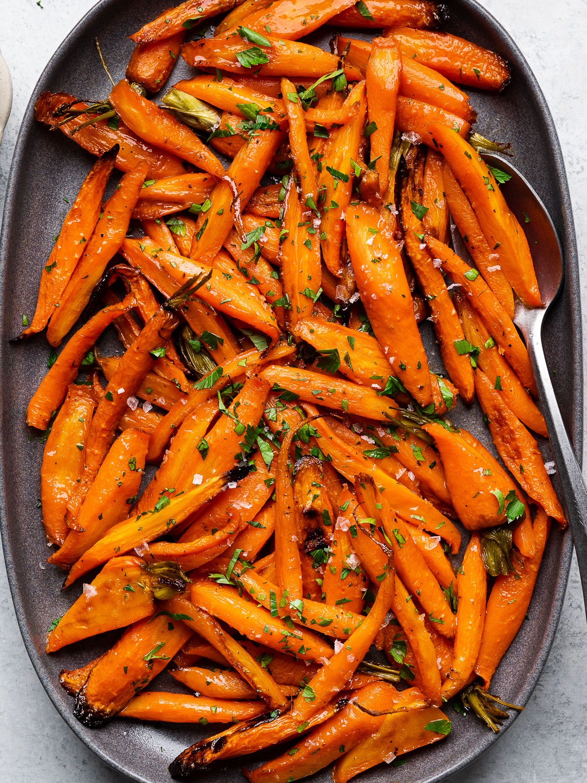 close up of roasted carrots on platter