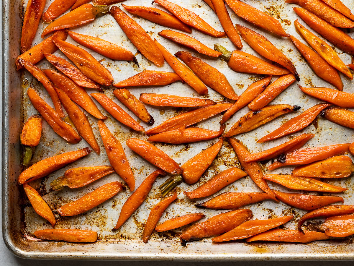 glazed roasted carrots on baking sheet