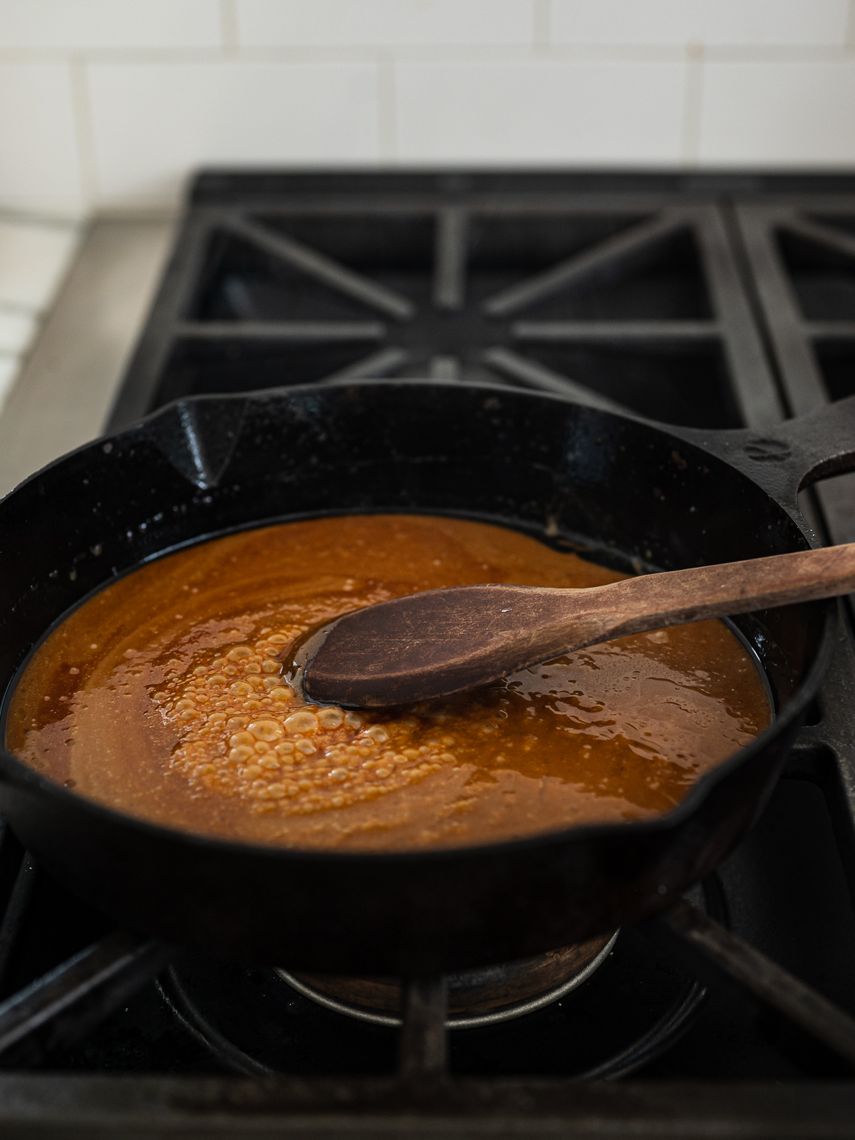 stirring caramel in skillet