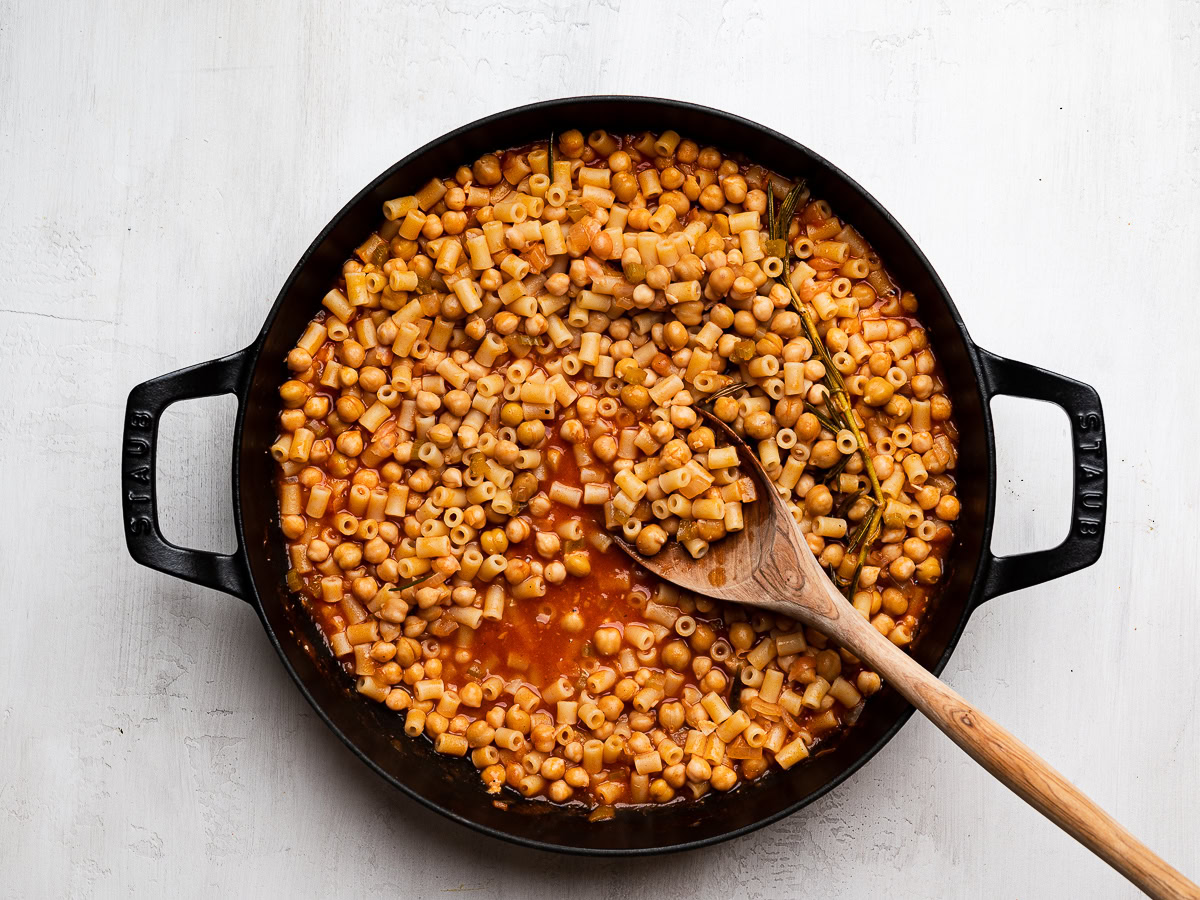 cooked pasta and chickpeas  in skillet