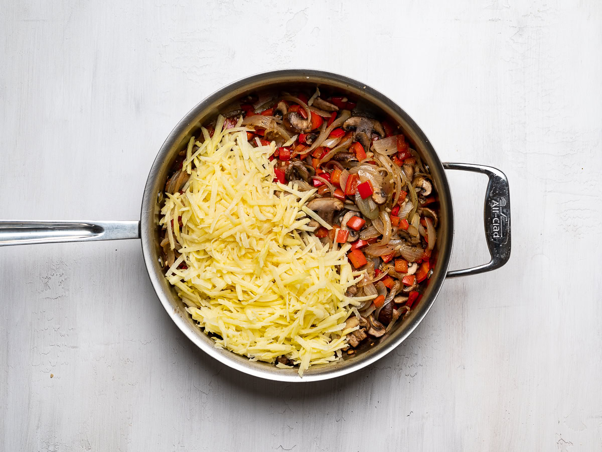 cooked vegetable mixture with hash browns in skillet