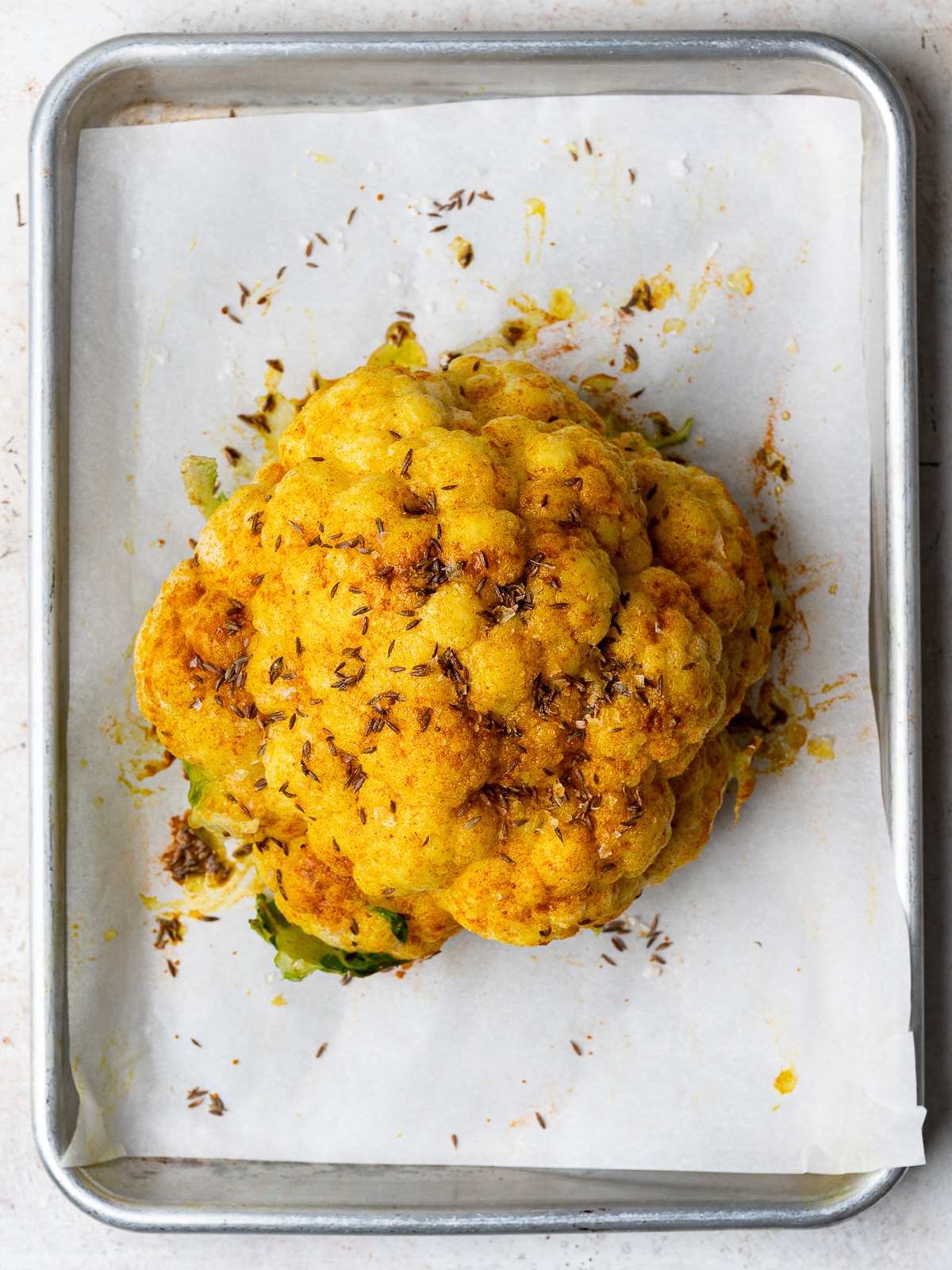 cauliflower rubbed with olive oil and spices before roasting