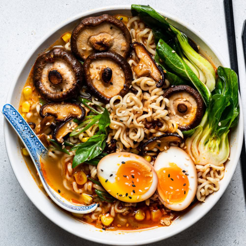 spicy miso ramen served in bowl with soy sauce eggs