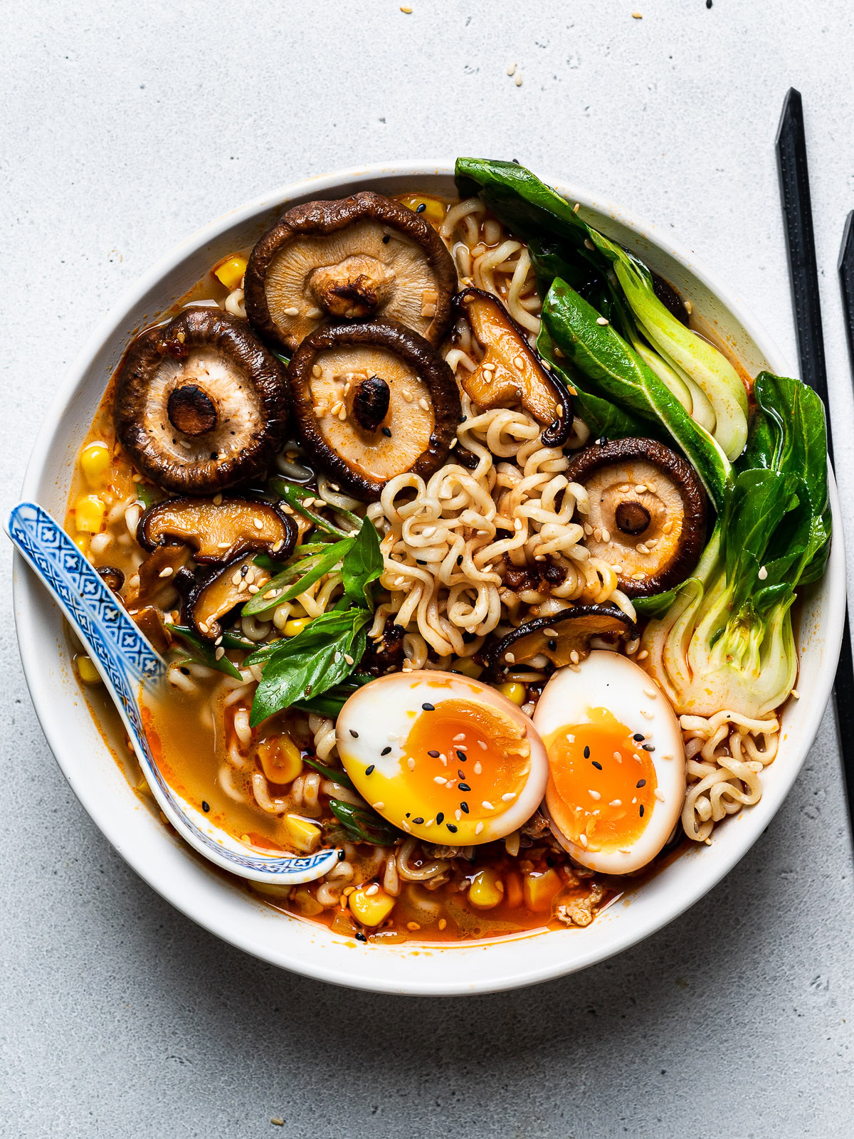 spicy miso ramen served in bowl with soy sauce eggs