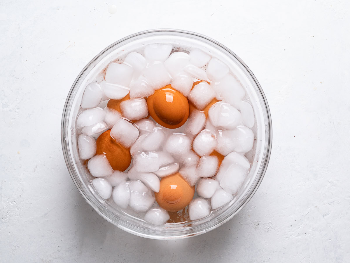 soft-boiled eggs soaking in ice water