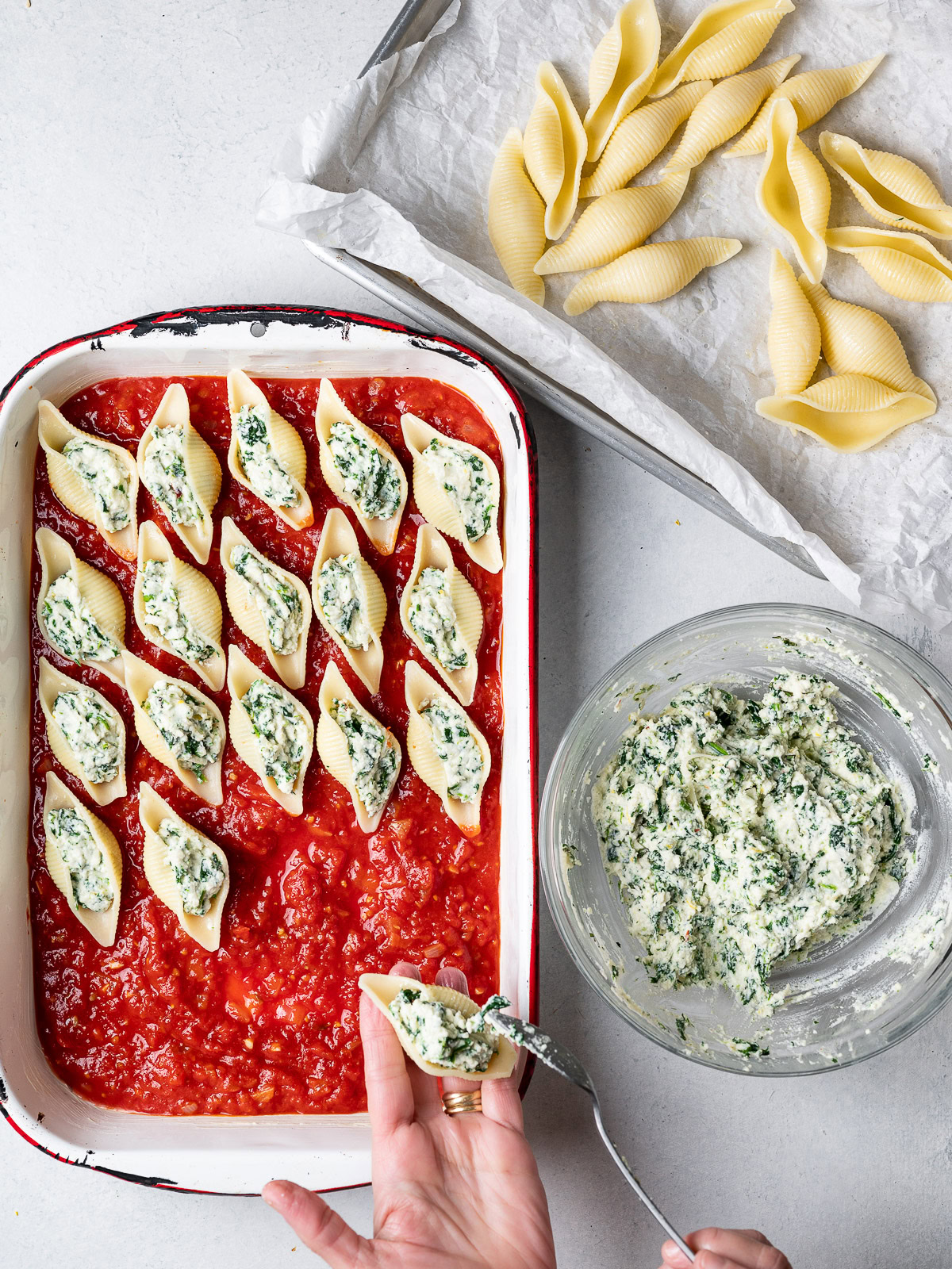 stuffing the shells with ricotta mixture