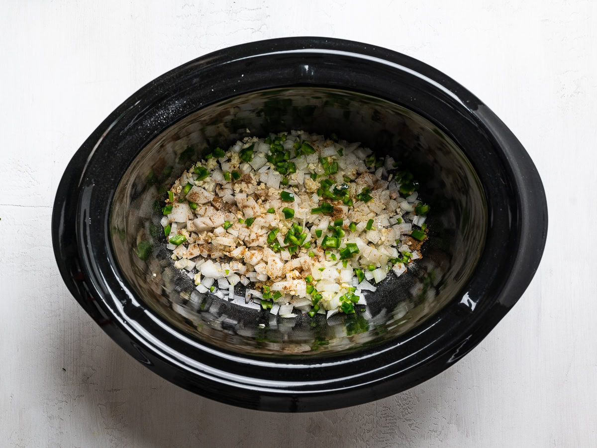 aromatics on the bottom of slow cooker bowl