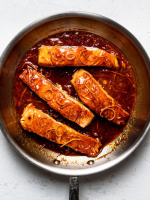 salmon in pan with tangerine sauce