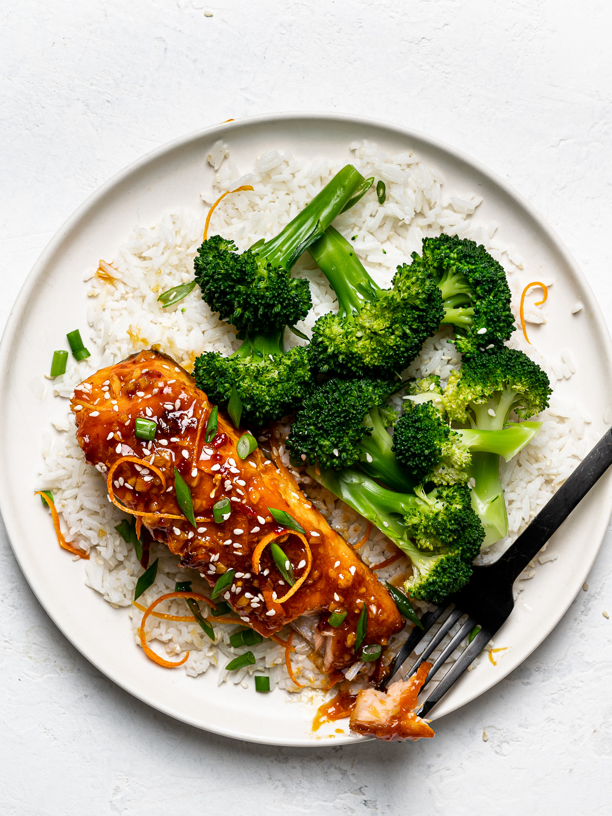 Spicy Tangerine Salmon served with rice and broccoli on plate