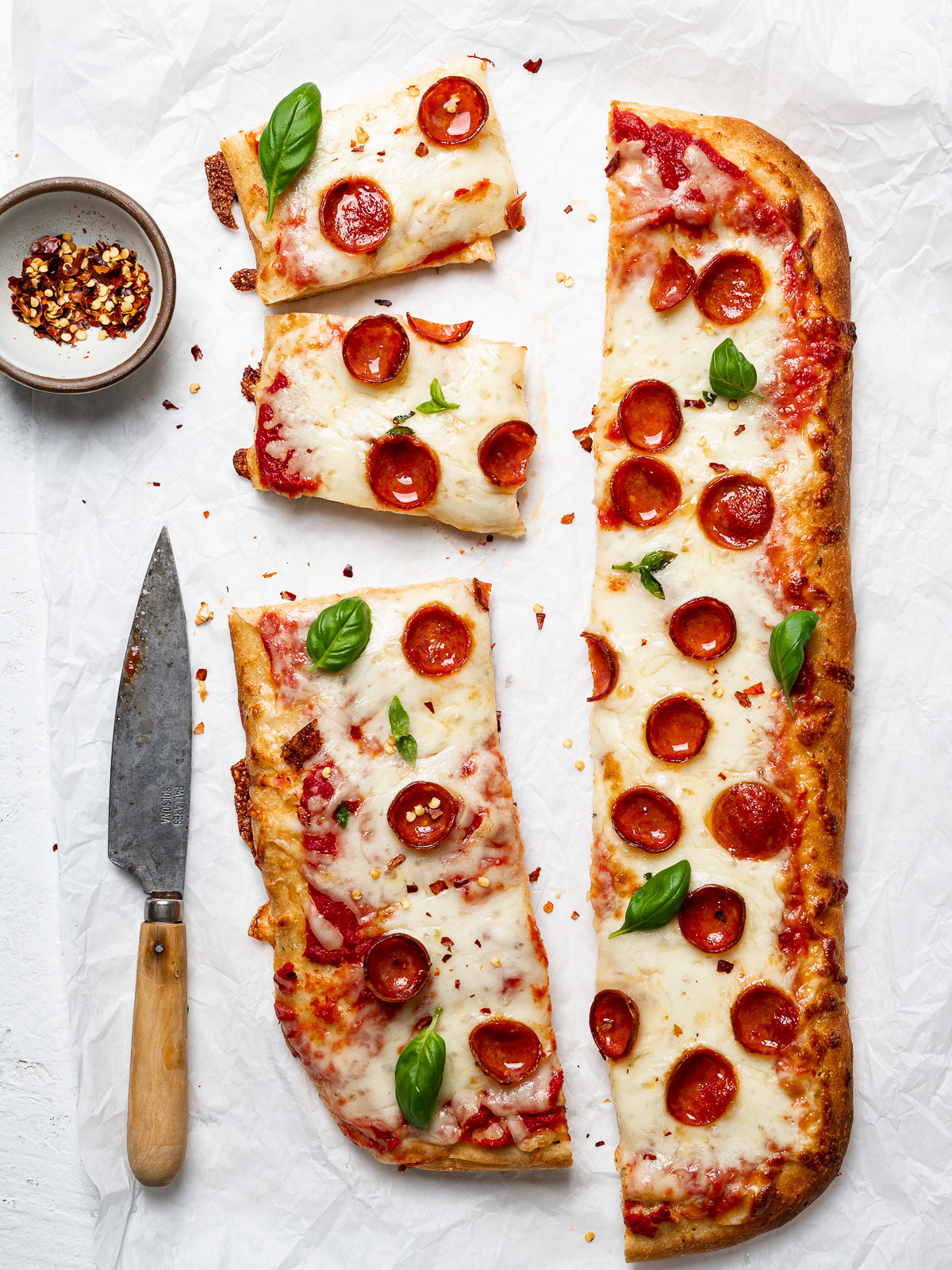 sliced Flatbread Pizza with cheese, pizza sauce, and pepperoni