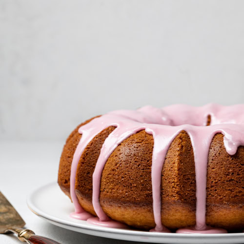 Side view of Olive oil yogurt cake with blood orange glaze