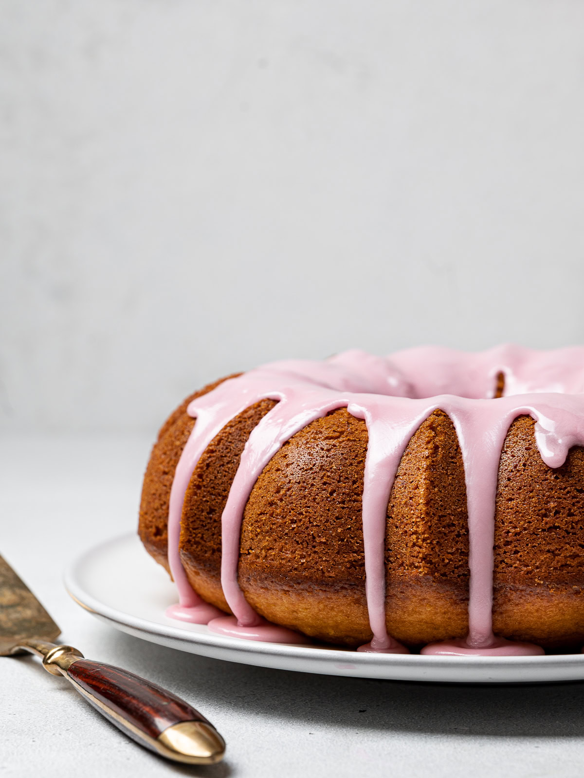 Side view of Olive oil yogurt cake with blood orange glaze