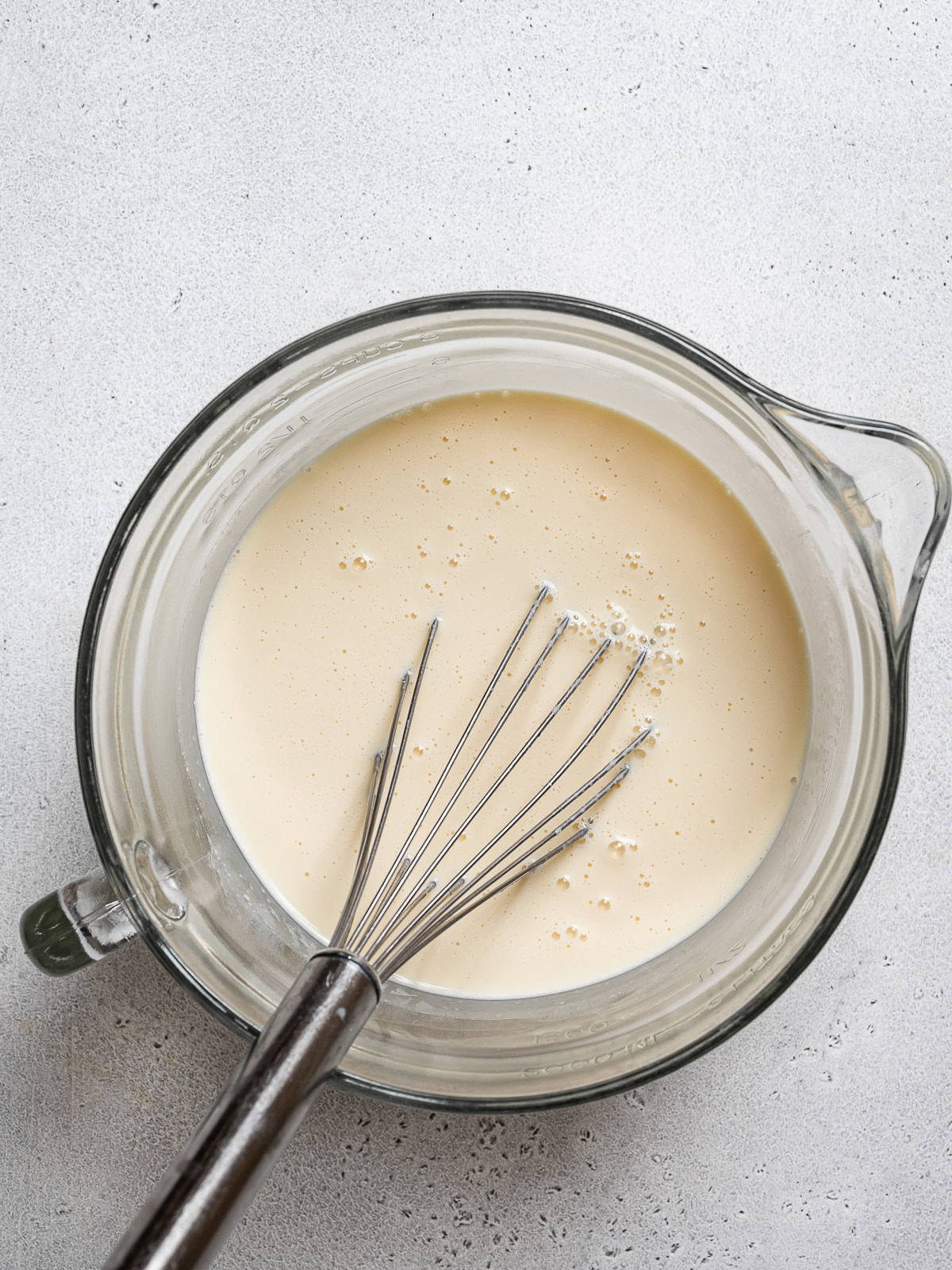 three milk mixture in large glass measuring cup