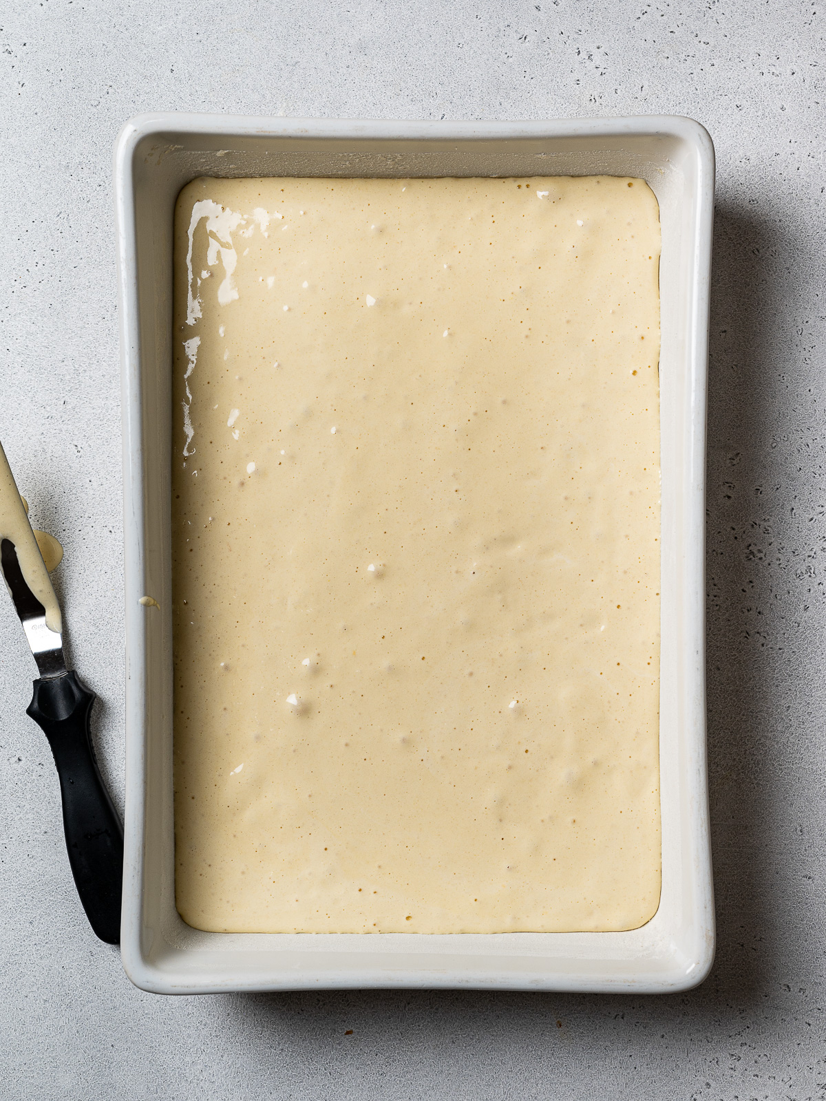 un-baked cake batter in baking dish