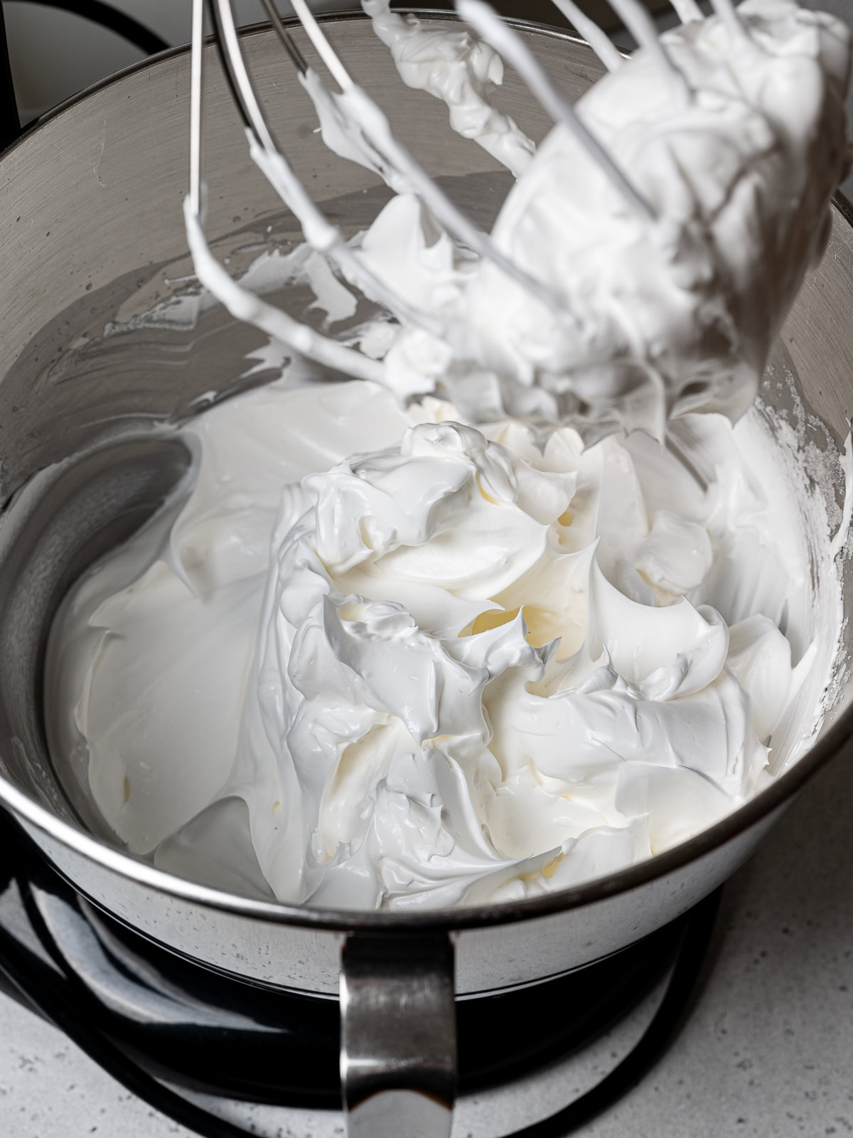 Beaten stiff and glossy egg whites in mixer 