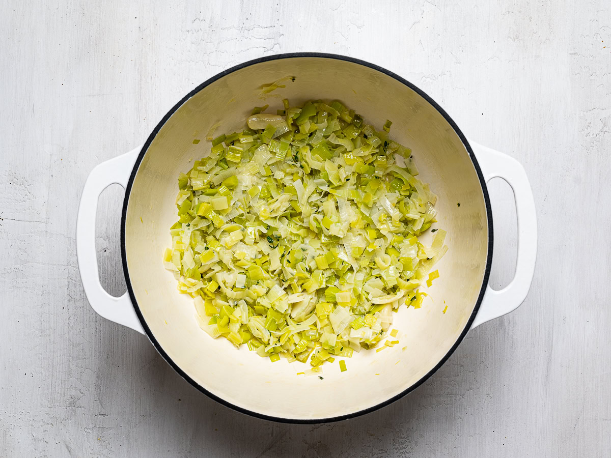 leeks sautéing in soup pot